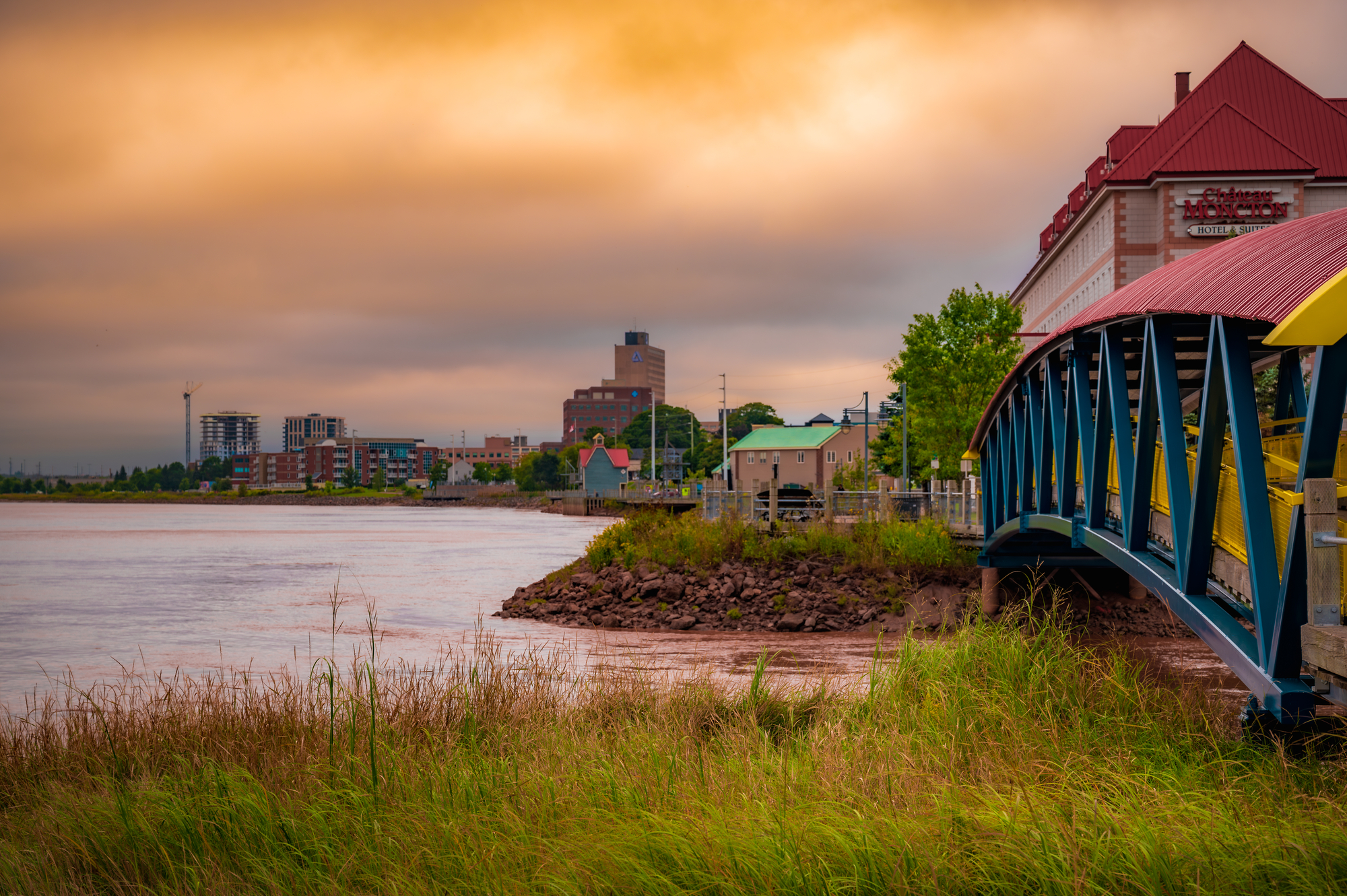 Skyline of the city of Moncton, Petitcodiack River and pedestrian bridge in New Brunswick, Canada.