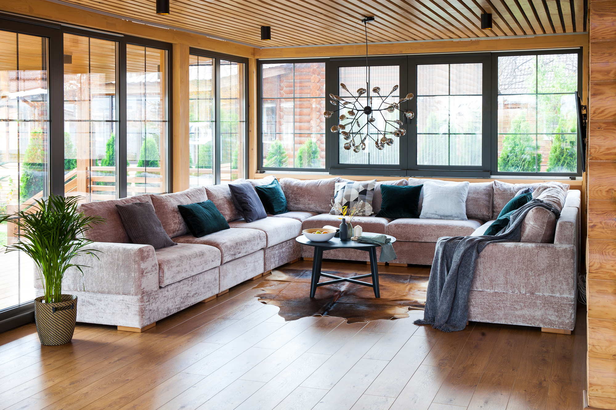living room with exposed beams and wooden floor
