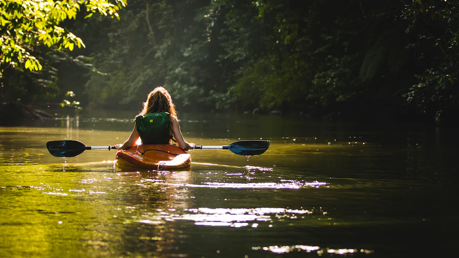 tourist kayaking in a river in Costa Rica