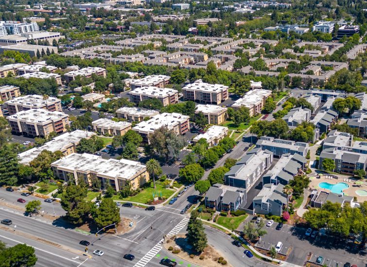 A real estate aerial view of an apartment complex in California.