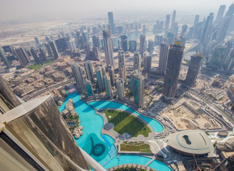         A mesmerizing view from the top of the Burj Khalifa in Dubai, showcasing the pinnacle of real estate brilliance.