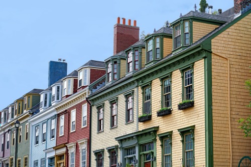 A row of colorful houses on a street in st john's, nova scotia.