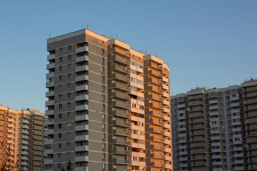 A group of apartment buildings at sunset.