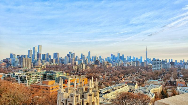 A view of the city of toronto from the top of a hill.