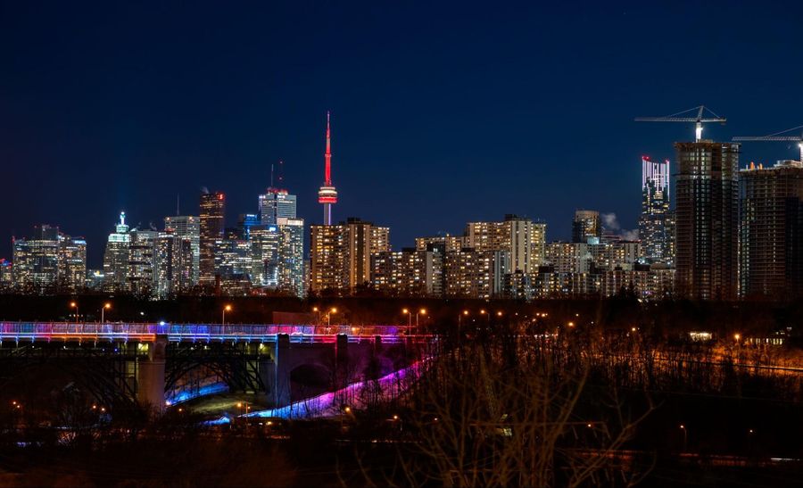 Toronto skyline at night with the cn tower in the background.