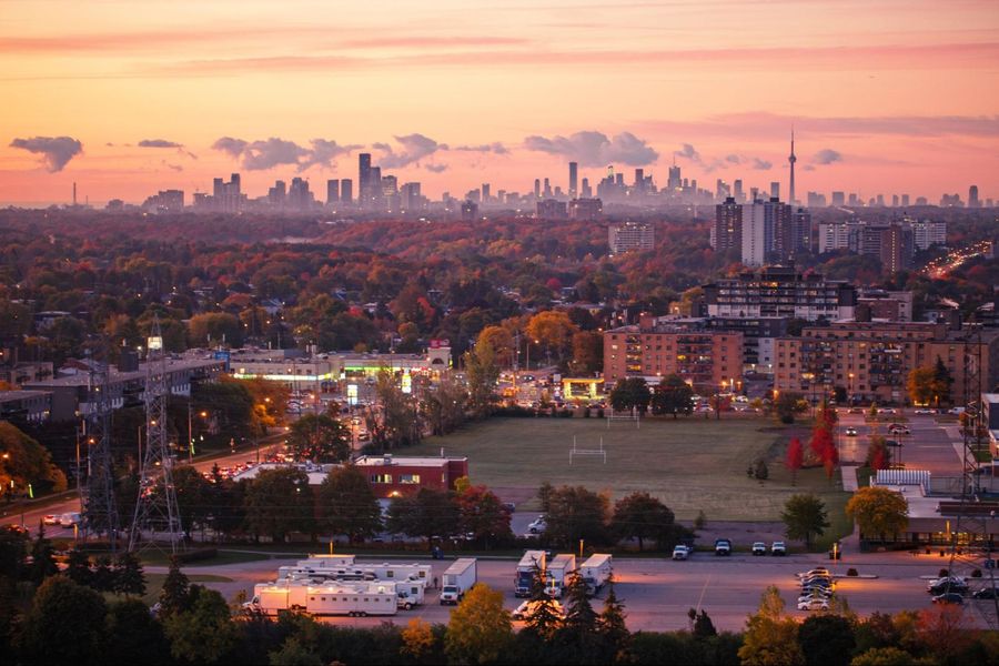 A view of the toronto skyline at sunset.