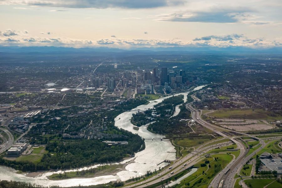 An aerial view of the city of calgary and a river.