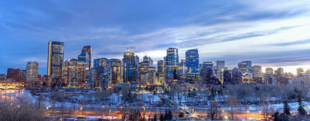 The city of calgary at dusk in winter.