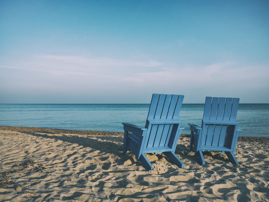 beach chairs on sandy beach in Turks and Caicos