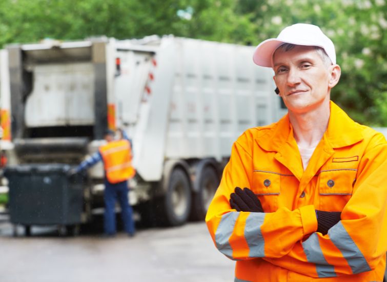Garbage collector efficiently removing waste bins and maintaining cleanliness in the community.