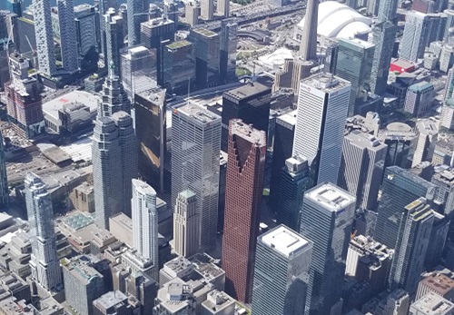 An aerial view of a city with tall buildings.