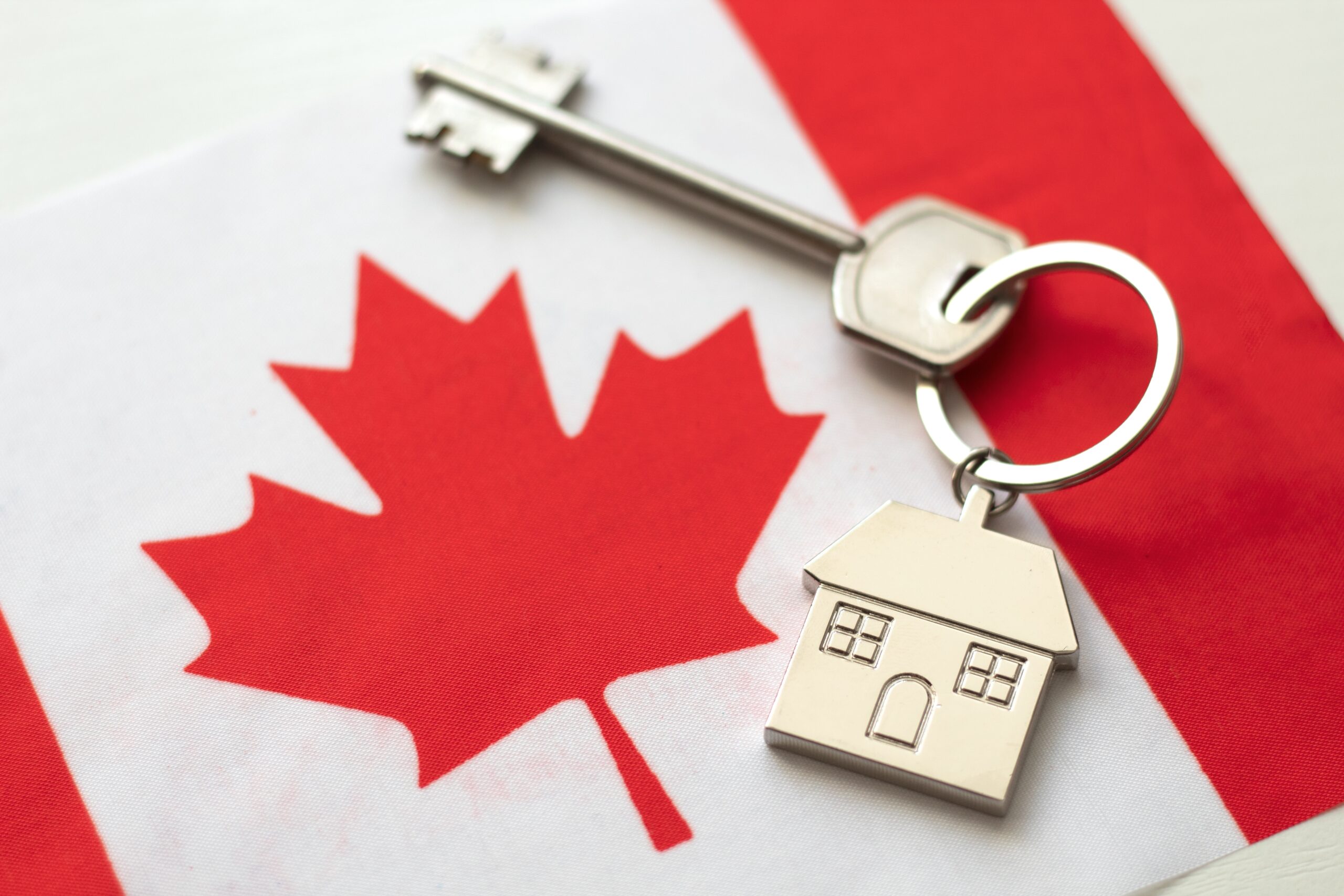 House,With,The,Flag,Of,Canada.,Immigration,To,Canada.,Buying