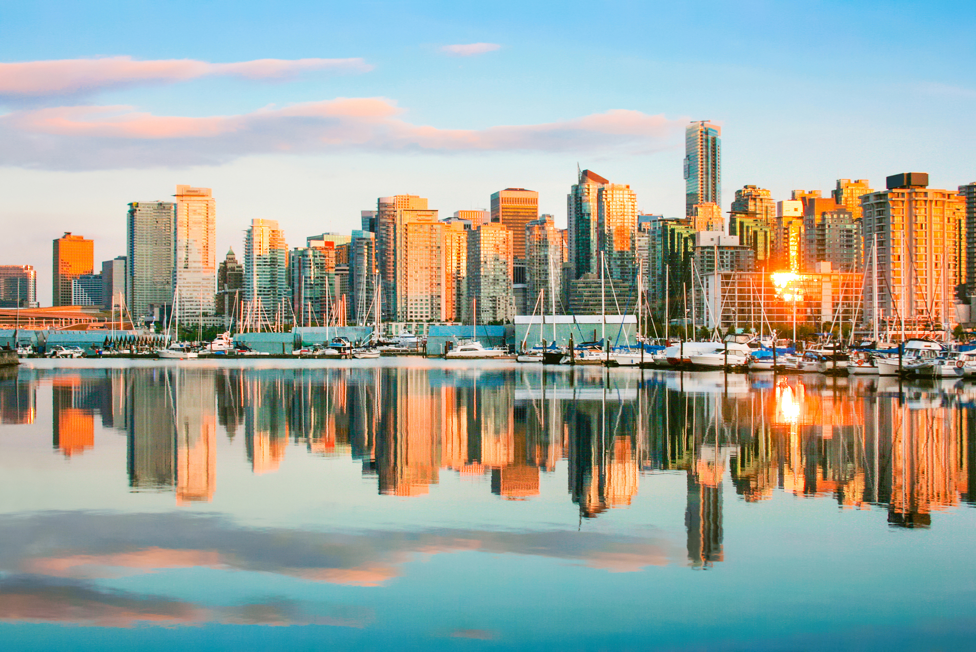 Beautiful view of Vancouver skyline with harbor at sunset, Briti