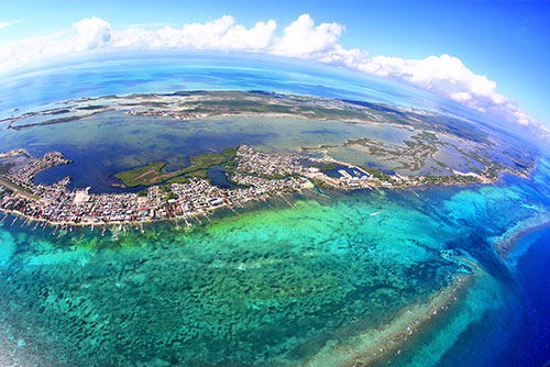A bird's eye view of a coral reef and ocean.