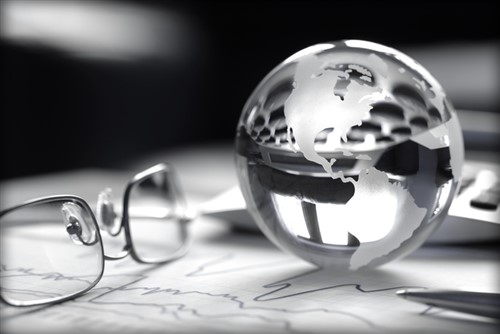 A glass globe sits on top of a piece of paper.