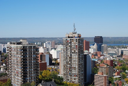 A view of a city with tall buildings and trees.