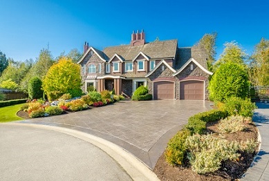 A beautiful home with a driveway and landscaping.