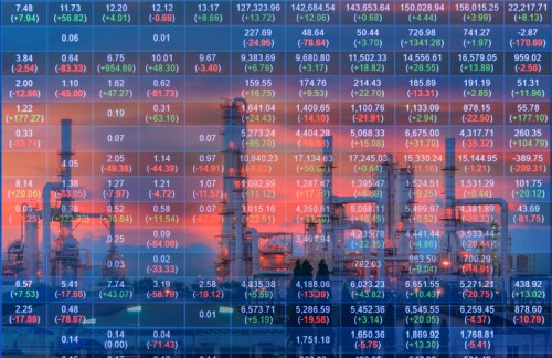 An oil refinery is shown on a background of a stock exchange.