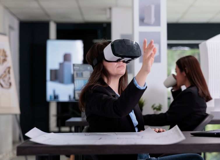 A woman immersed in an AI experience while wearing a VR headset in an office.