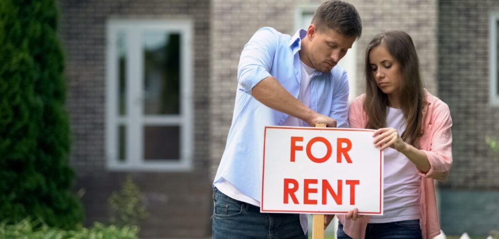 couple-installing-rent-signboard-family needs additional income crisis