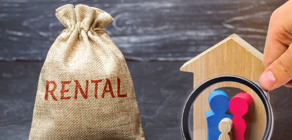 A person holding a bag with the word rental on it.